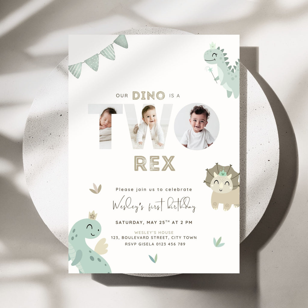 A dinosaur-themed 2nd birthday invitation card displayed on a round white plate. The card features cute cartoon dinosaurs in sage green and beige, with placeholders for photos inside the letters 'TWO' and additional text for a child's first birthday.