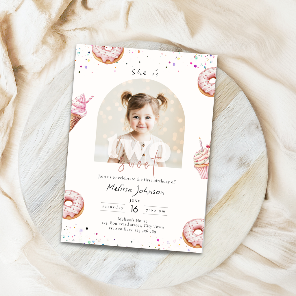 Invitation card for a 2nd  birthday with a photo of a child on a marble surface
